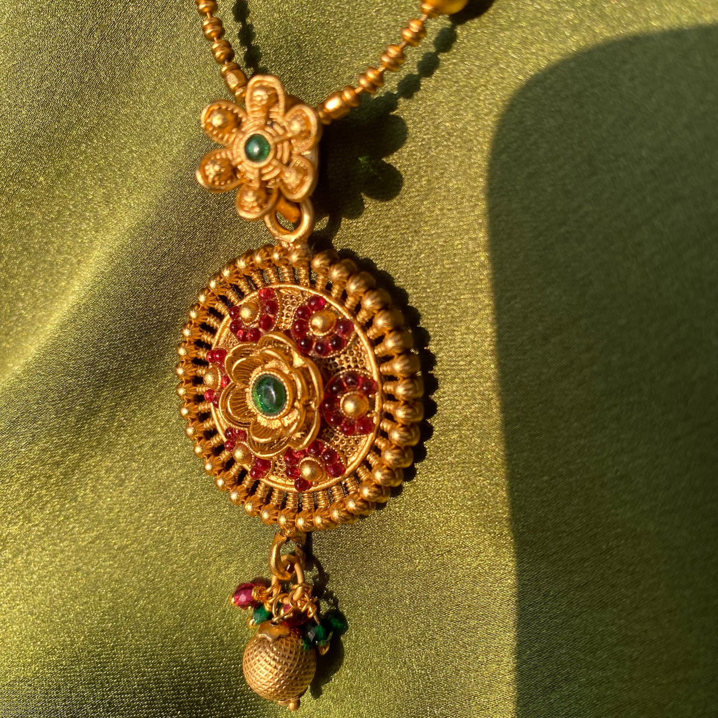Matte Gold South Indian Floral Pendant Necklace Set with Red & Green Stones