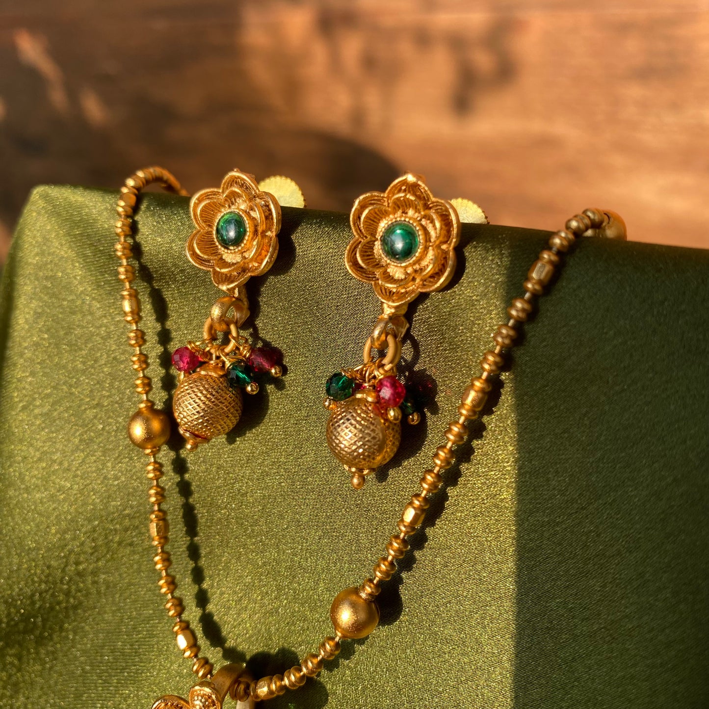 Matte Gold South Indian Floral Pendant Necklace Set with Red & Green Stones