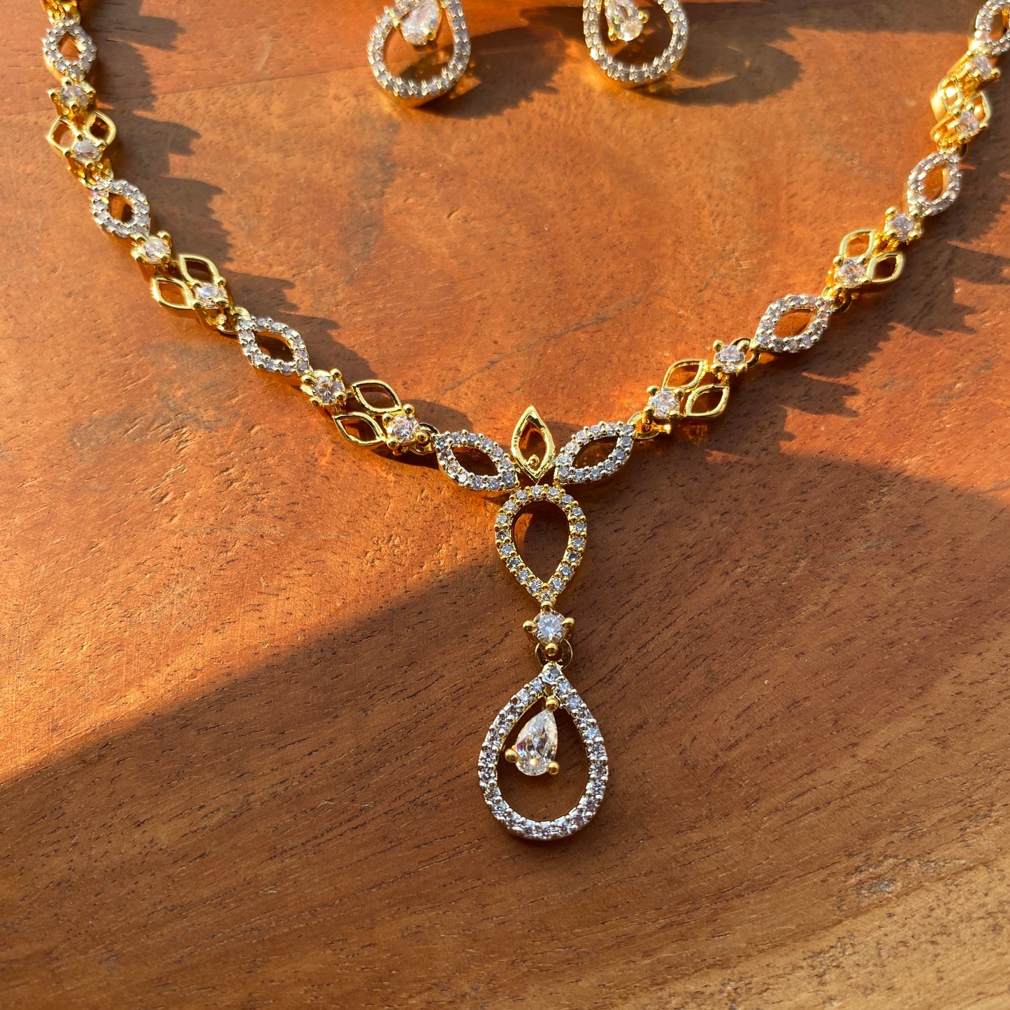 Sleek Almond & Drop Shaped Designer CZ/AD Gold Necklace Set