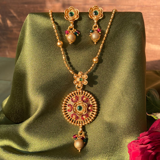Matte Gold South Indian Floral Pendant Necklace Set with Red & Green Stones