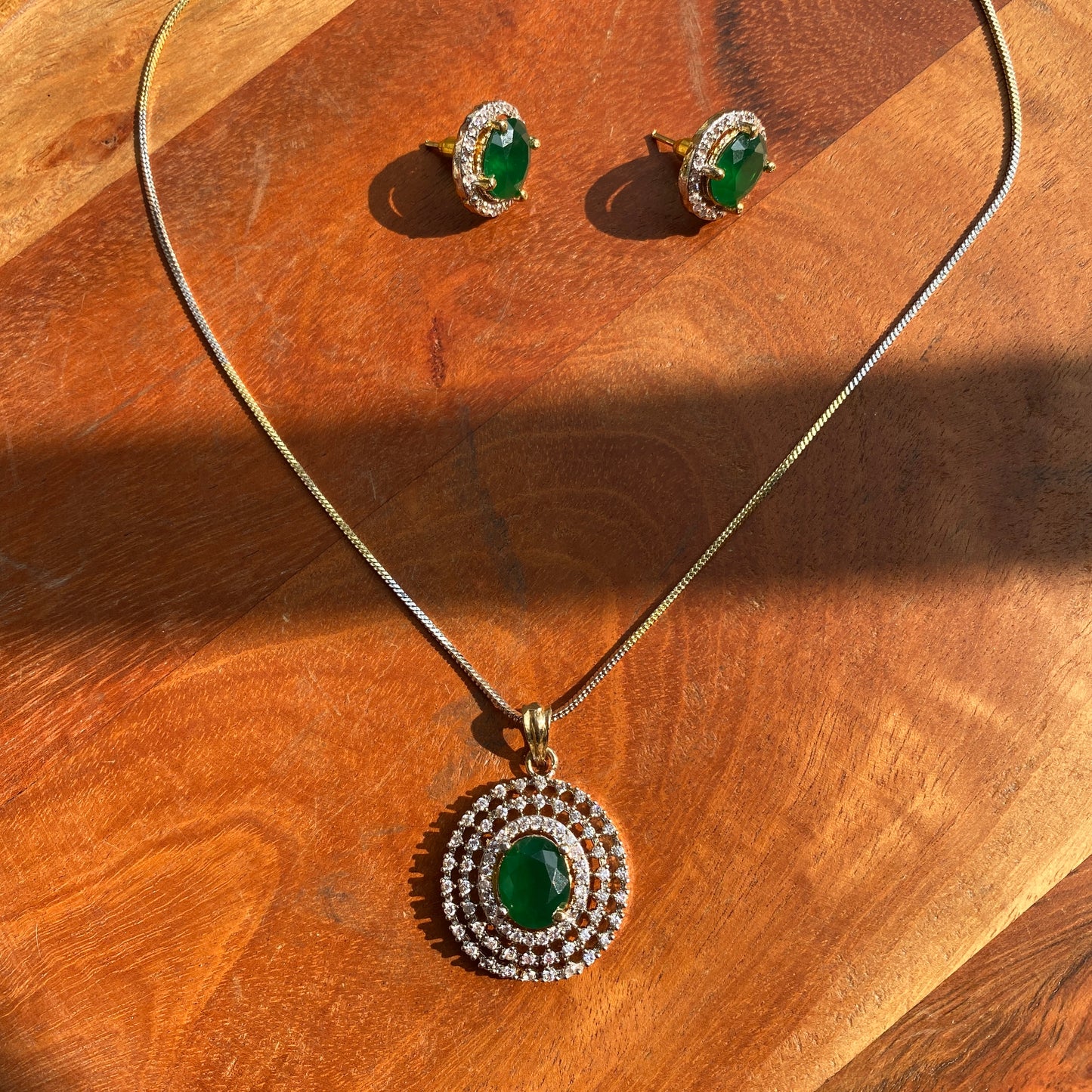 Elegant Golden and Silver Toned CZ Pendant Set with Green Stone (With Chain)